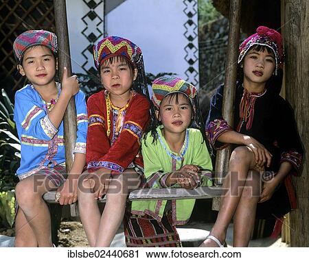Stock Image - "Miao children wearing traditional ethnic costumes, Hainan, China, Asia". Fotosearch