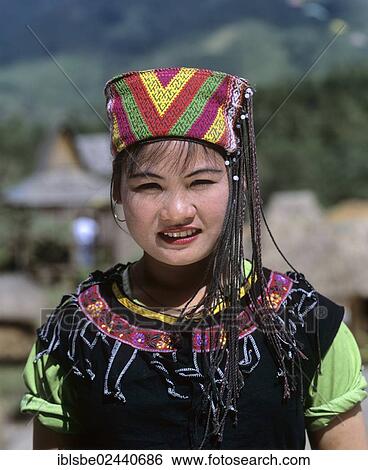 Stock Photograph - "Miao girl wearing a traditional ethnic costume, portrait, Hainan, China, Asia". Fotosearch