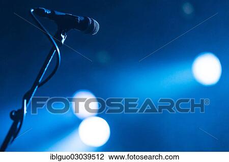 Microphone on a stand in the spotlight View Large Photo Image Stock Image - Microphone on a stand in the spotlight. Fotosearch