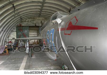 Stock Photo - "MIG-21 SMT aircraft, a relatively rare version in Germany, left behind in 1993 by the Soviet air forces during their withdrawal, in a hangar at the Altenburg Nobitz Airfield, Nobitz, Altenburg, Thuringia, Germany, Europe". Fotosearch