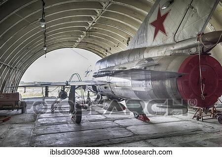 Stock Photo - "MIG-21 SMT aircraft, a relatively rare version in Germany, left behind in 1993 by the Soviet air forces during their withdrawal, in a hangar at the Altenburg Nobitz Airfield, Nobitz, Altenburg, Thuringia, Germany, Europe". Fotosearch