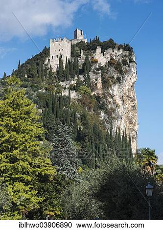 "Mighty cliff with the ruins of Arco Castle or Castello di Arco above Arco, Sarca Valley, Trentino-Alto Adige, Italy, Europe" View Large Photo Image Stock Image - "Mighty cliff with the ruins of Arco Castle or Castello di Arco above Arco, Sarca Valley, Trentino-Alto Adige, Italy, Europe". Fotosearch