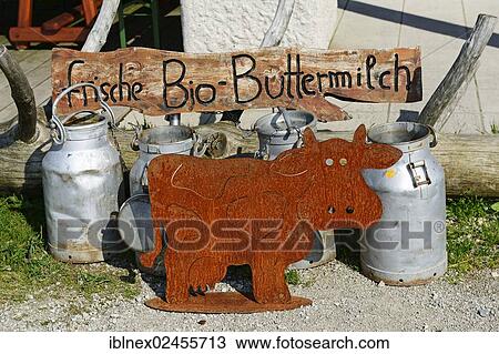"Milk cans in front of the Sonnenalm with a sign """"frische Bio-Buttermilch"""", German for """"fresh organic buttermilk"""", at Mt Kampenwand, Chiemgau region, Upper Bavaria, Bavaria, Germany, Europe" View Large Photo Image Stock Image - "Milk cans in front of the Sonnenalm with a sign """"frische Bio-Buttermilch"""", German for """"fresh organic buttermilk"""", at Mt Kampenwand, Chiemgau region, Upper Bavaria, Bavaria, Germany, Europe". Fotosearch