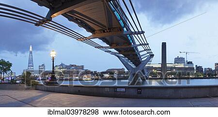 "Millennium Bridge from below with views of The Shard skyscraper and Tate Modern, River Thames, London, England, United Kingdom, Europe" View Large Photo Image Stock Photo - "Millennium Bridge from below with views of The Shard skyscraper and Tate Modern, River Thames, London, England, United Kingdom, Europe". Fotosearch
