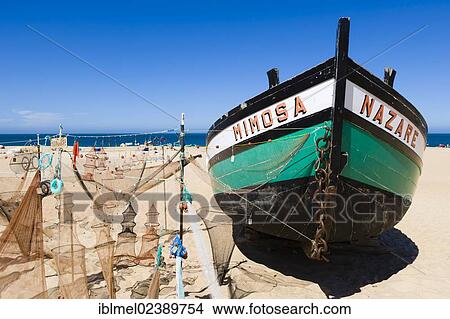 Picture - "Mimosa fishing boat and nets, Praia da Nazare, Beach, Nazare, Oeste, Leiria District, Portugal, Europe". Fotosearch