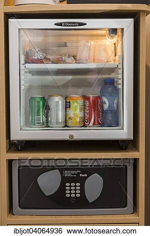 Mini bar with drinks and a safe for valuables in a hotel room View Large Photo Image Stock Photograph - Mini bar with drinks and a safe for valuables in a hotel room. Fotosearch