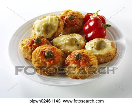 "Mini potato rosti topped with tomato salsa, capers, melted cheese or olives" View Large Photo Image Stock Image - "Mini potato rosti topped with tomato salsa, capers, melted cheese or olives". Fotosearch