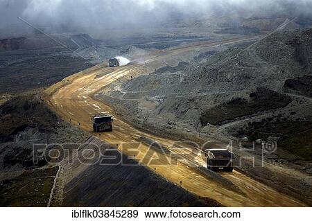 "Mining, rock is being removed by trucks, Yanacocha Gold Mine, Cajamarca, Cajamarca region, Peru, South America" View Large Photo Image Stock Photo - "Mining, rock is being removed by trucks, Yanacocha Gold Mine, Cajamarca, Cajamarca region, Peru, South America". Fotosearch