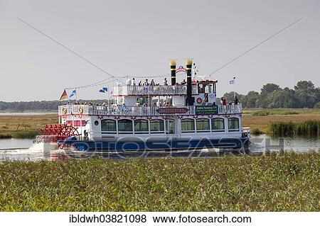 Stock Photo - "Mississippi paddle steamer Baltic Star on the Bodden, Baltic Sea peninsula of Fischland-Darss-Zingst, Zingst, Mecklenburg-Vorpommern, Germany, Europe". Fotosearch