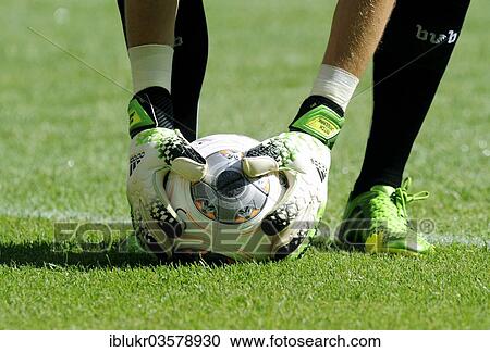 Stock Image - "Mitchell Langerak, goalkeeper of Borussia Dortmund, picking up the new Adidas Bundesliga football, Telekom Cup 2013 in Borussia Park Moenchengladbach, Monchengladbach, North Rhine-Westphalia, Germany, Europe". Fotosearch