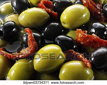 Stock Image - Mixed black and green olives. Fotosearch
