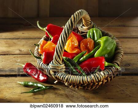 Stock Photo - Mixed fresh chilis in a basket. Fotosearch