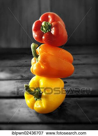 Stock Photo - "Mixed red, yellow and orange fresh bell peppers". Fotosearch