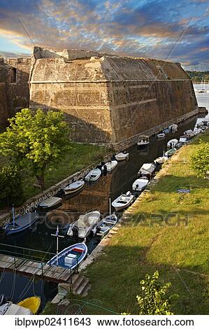 Moat and fortress walls of the old citadel of Corfu Town castle, Corfu, Ionian Islands, Greece, Europe View Large Photo Image Stock Image - Moat and fortress walls of the old citadel of Corfu Town castle, Corfu, Ionian Islands, Greece, Europe. Fotosearch