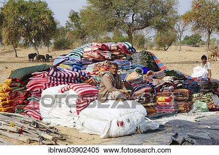 "Mobile traders with carpets, blankets and other fabrics, Rajasthan, India, Asia" View Large Photo Image Stock Photography - "Mobile traders with carpets, blankets and other fabrics, Rajasthan, India, Asia". Fotosearch