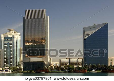 "Modern architecture at Dubai Creek, from left, Dubai Creek Tower, National Bank of Dubai and the Chamber of Industry and Commerce, Dubai, United Arab Emirates, Asia" View Large Photo Image Stock Image - "Modern architecture at Dubai Creek, from left, Dubai Creek Tower, National Bank of Dubai and the Chamber of Industry and Commerce, Dubai, United Arab Emirates, Asia". Fotosearch