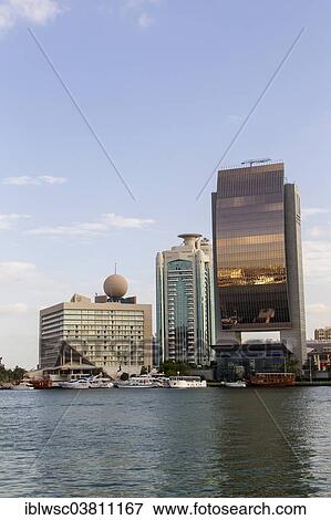 "Modern architecture at Dubai Creek, Dubai Creek Tower, National Bank of Dubai, Deira, Dubai, United Arab Emirates, Asia" View Large Photo Image Stock Photo - "Modern architecture at Dubai Creek, Dubai Creek Tower, National Bank of Dubai, Deira, Dubai, United Arab Emirates, Asia". Fotosearch