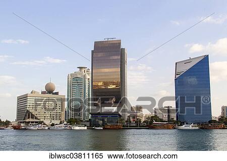 Stock Photography - "Modern architecture at Dubai Creek, Dubai Creek Tower, National Bank of Dubai, Dubai Chamber of Commerce and Industry, Deira, Dubai, United Arab Emirates, Asia". Fotosearch