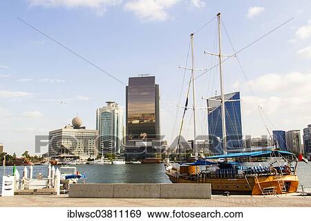 "Modern architecture at the Dubai Creek, Dubai Creek Tower, National Bank of Dubai, Dubai Chamber of Commerce and Industry, Deira, Dubai, United Arab Emirates, Asia" View Large Photo Image Stock Photo - "Modern architecture at the Dubai Creek, Dubai Creek Tower, National Bank of Dubai, Dubai Chamber of Commerce and Industry, Deira, Dubai, United Arab Emirates, Asia". Fotosearch