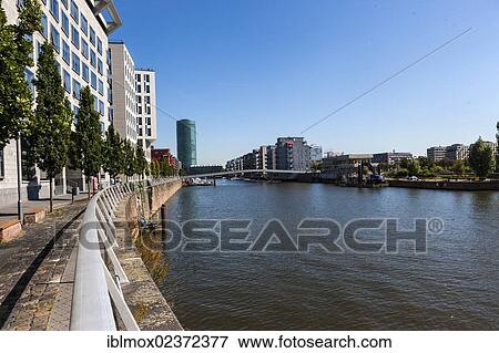 "Modern luxury apartments at Westhafen harbour with a private jetty and views of Westhafen Tower, Westhafenplatz square, Frankfurt am Main, Hesse, Germany, Europe, PublicGround, Europe" View Large Photo Image Stock Photo - "Modern luxury apartments at Westhafen harbour with a private jetty and views of Westhafen Tower, Westhafenplatz square, Frankfurt am Main, Hesse, Germany, Europe, PublicGround, Europe". Fotosearch