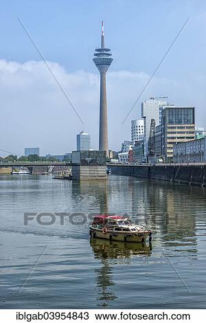 Stock Image - "Modern office buildings and Rhein Tower, Medienhafen or Media Harbour, Dusseldorf, Rhineland, North Rhine-Westphalia, Germany, Europe". Fotosearch