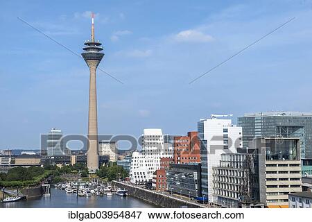 Stock Photo - "Modern office buildings and Rhein Tower, Medienhafen or Media Harbour, Dusseldorf, Rhineland, North Rhine-Westphalia, Germany, Europe". Fotosearch