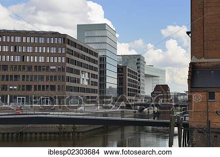 Picture - "Modern office buildings at Brooktorhafen harbour with Museumsbruecke bridge, HafenCity, Hamburg, Hamburg, Germany, Europe". Fotosearch
