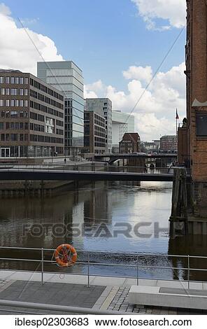 Stock Image - "Modern office buildings at Brooktorhafen harbour with Museumsbruecke bridge, HafenCity, Hamburg, Hamburg, Germany, Europe". Fotosearch