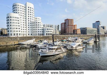 Stock Image - "Modern office buildings New Zollhof, Medienhafen or Media Harbour, Dusseldorf, Rhineland, North Rhine-Westphalia, Germany, Europe". Fotosearch
