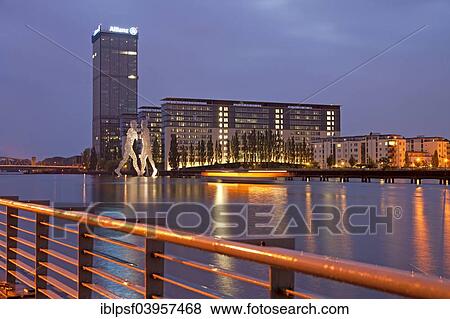 "Molecule Man, artwork by American sculptor Jonathan Borofsky, and Treptowers building complex on the River Spree, Treptow, Berlin, Germany, Europe" View Large Photo Image Stock Photo - "Molecule Man, artwork by American sculptor Jonathan Borofsky, and Treptowers building complex on the River Spree, Treptow, Berlin, Germany, Europe". Fotosearch