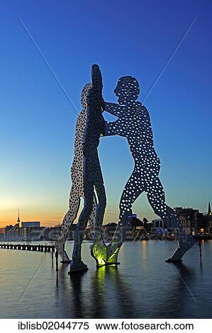 "Molecule Men, 30 metre high artwork made of aluminium, sculpted by Jonathan Borofsky, standing in the Spree River, at sunset, Berlin, Germany, Europe, PublicGround, Europe" View Large Photo Image Stock Photography - "Molecule Men, 30 metre high artwork made of aluminium, sculpted by Jonathan Borofsky, standing in the Spree River, at sunset, Berlin, Germany, Europe, PublicGround, Europe". Fotosearch