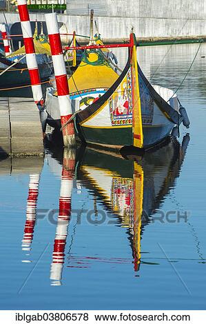 Stock Photo - "Moliceiro boat anchored on a canal, Aveiro, Centro region, Portugal, Europe". Fotosearch
