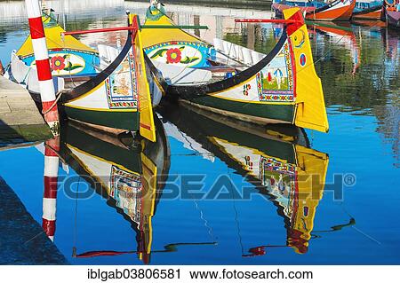 Stock Image - "Moliceiro boats anchored along a canal, Aveiro, Centro region, Portugal, Europe". Fotosearch