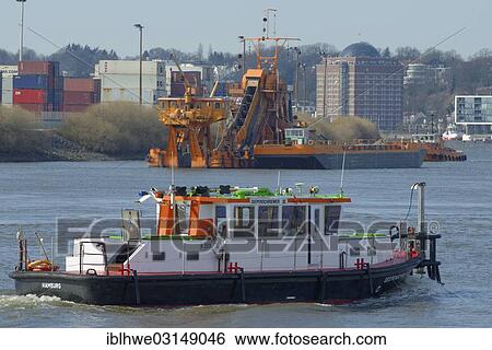 "Monitoring vessel """"Deepenschriewer"""" in front of a bucket-chain dredger, Hamburg, Hamburg, Hamburg, Germany, Europe" View Large Photo Image Stock Photograph - "Monitoring vessel """"Deepenschriewer"""" in front of a bucket-chain dredger, Hamburg, Hamburg, Hamburg, Germany, Europe". Fotosearch