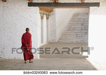 Stock Image - "Monk at Punakha Dzong, Punakha, Punakha district, Bhutan, Asia". Fotosearch