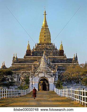 Stock Photo - "Monk in front of Ananda Temple, gilded tower construction, Shikhara, porch, Ebene von Pagan, Bagan, Mandalay Division, Myanmar, Burma, Asia". Fotosearch
