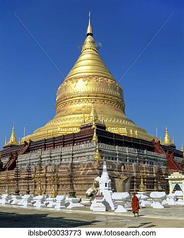 "Monk in front of Shwezigon Pagoda with its golden chedi, Nyaung U, Ebene von Pagan, Bagan, Mandalay Division, Myanmar, Burma, Asia" View Large Photo Image Stock Image - "Monk in front of Shwezigon Pagoda with its golden chedi, Nyaung U, Ebene von Pagan, Bagan, Mandalay Division, Myanmar, Burma, Asia". Fotosearch