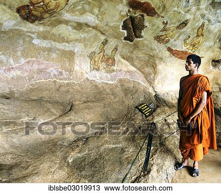 "Monk looking at the """"cloud girls"""" petroglyphs at Lion Rock, frescoes, murals, UNESCO World Heritage Site, Sigiriya, Sigirija, Zentralprovinz, Sri Lanka, Asia" View Large Photo Image Stock Image - "Monk looking at the """"cloud girls"""" petroglyphs at Lion Rock, frescoes, murals, UNESCO World Heritage Site, Sigiriya, Sigirija, Zentralprovinz, Sri Lanka, Asia". Fotosearch