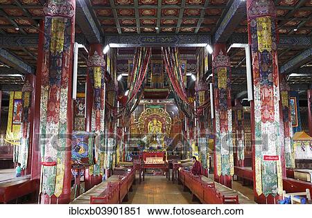 Stock Image - "Monk praying in the prayer hall in Amarbayasgalant Monastery, Selenge Aimag, Mongolia, Asia". Fotosearch