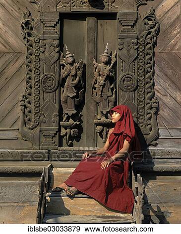 "Monk sitting in front of a carved teak door, Shwe In Bin Kyaung Monastery, Mandalay, Mandalay Division, Myanmar, Burma, Asia" View Large Photo Image Stock Photo - "Monk sitting in front of a carved teak door, Shwe In Bin Kyaung Monastery, Mandalay, Mandalay Division, Myanmar, Burma, Asia". Fotosearch