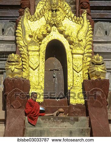"Monk sitting on a staircase at the door of Shwezigon Pagoda with its golden chedi, Nyaung U, Ebene von Pagan, Bagan, Mandalay Division, Myanmar, Burma, Asia" View Large Photo Image Stock Photo - "Monk sitting on a staircase at the door of Shwezigon Pagoda with its golden chedi, Nyaung U, Ebene von Pagan, Bagan, Mandalay Division, Myanmar, Burma, Asia". Fotosearch
