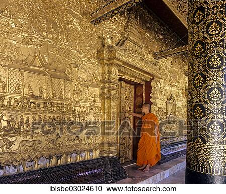 "Monk standing at the gilded doors of Wat Mai Temple, Luang Prabang, Luang Prabang Province, Laos, Asia" View Large Photo Image Stock Image - "Monk standing at the gilded doors of Wat Mai Temple, Luang Prabang, Luang Prabang Province, Laos, Asia". Fotosearch
