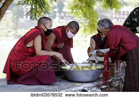 "Monks distributing rice to a needy visitor at the entrance of a building in Punakha Dzong fortress, Punakha, Punakha district, Bhutan, Asia" View Large Photo Image Stock Image - "Monks distributing rice to a needy visitor at the entrance of a building in Punakha Dzong fortress, Punakha, Punakha district, Bhutan, Asia". Fotosearch