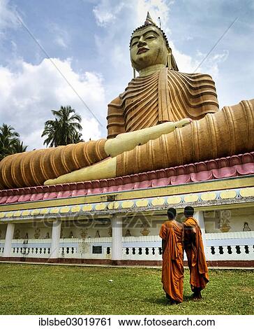 "Monks standing in front of giant Buddha statue, Wewurukannala Vihara temple, Dikwella, Galle, Sudprovinz, Sri Lanka, Asia" View Large Photo Image Stock Image - "Monks standing in front of giant Buddha statue, Wewurukannala Vihara temple, Dikwella, Galle, Sudprovinz, Sri Lanka, Asia". Fotosearch