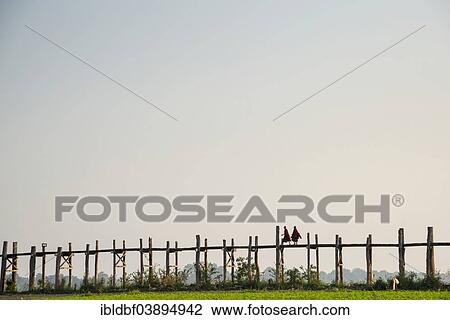 "Monks walking on a teak bridge, U Bein Bridge, across Thaungthaman lake, Amarapura, Mandalay Division, Myanmar, Asia" View Large Photo Image Stock Image - "Monks walking on a teak bridge, U Bein Bridge, across Thaungthaman lake, Amarapura, Mandalay Division, Myanmar, Asia". Fotosearch