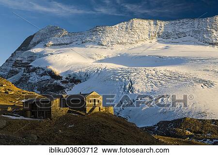 Stock Image - "Monte Leone hut, Monte Leone mountain and Chaltwassergletscher glacier, Simplon region, Canton of Valais, Switzerland, Europe". Fotosearch