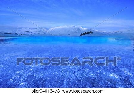"Monte Vettore at blue hour with a frozen puddle with air bubbles, Monti Sibillini National Park, Umbria, Italy, Europe" View Large Photo Image Stock Image - "Monte Vettore at blue hour with a frozen puddle with air bubbles, Monti Sibillini National Park, Umbria, Italy, Europe". Fotosearch