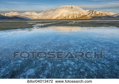 "Monte Vettore in the evening light with a frozen puddle with air bubbles, Monti Sibillini National Park, Umbria, Italy, Europe" View Large Photo Image Stock Image - "Monte Vettore in the evening light with a frozen puddle with air bubbles, Monti Sibillini National Park, Umbria, Italy, Europe". Fotosearch