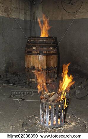 Stock Image - "Montilla, toasting barrels at the cooperage, Cooperage Manuel Cabello, Montilla-Moriles area, Cordoba province, Andalusia, Spain, Europe". Fotosearch