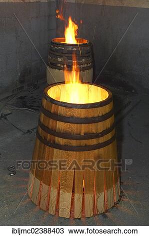 Stock Image - "Montilla, toasting barrels at the cooperage, Cooperage Manuel Cabello, Montilla- Moriles area, Cordoba province, Andalusia, Spain, Europe". Fotosearch
